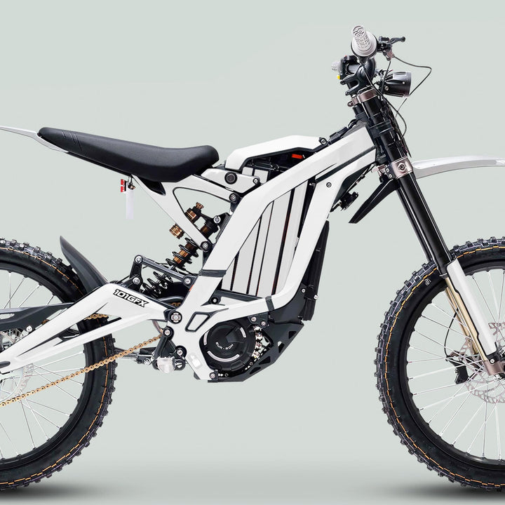 Surron Light Bee X Graphics Kit MONO COLOR White enhances a white electric dirt bike's rugged design, featuring durable decals fitting seamlessly over its minimalist frame and components.